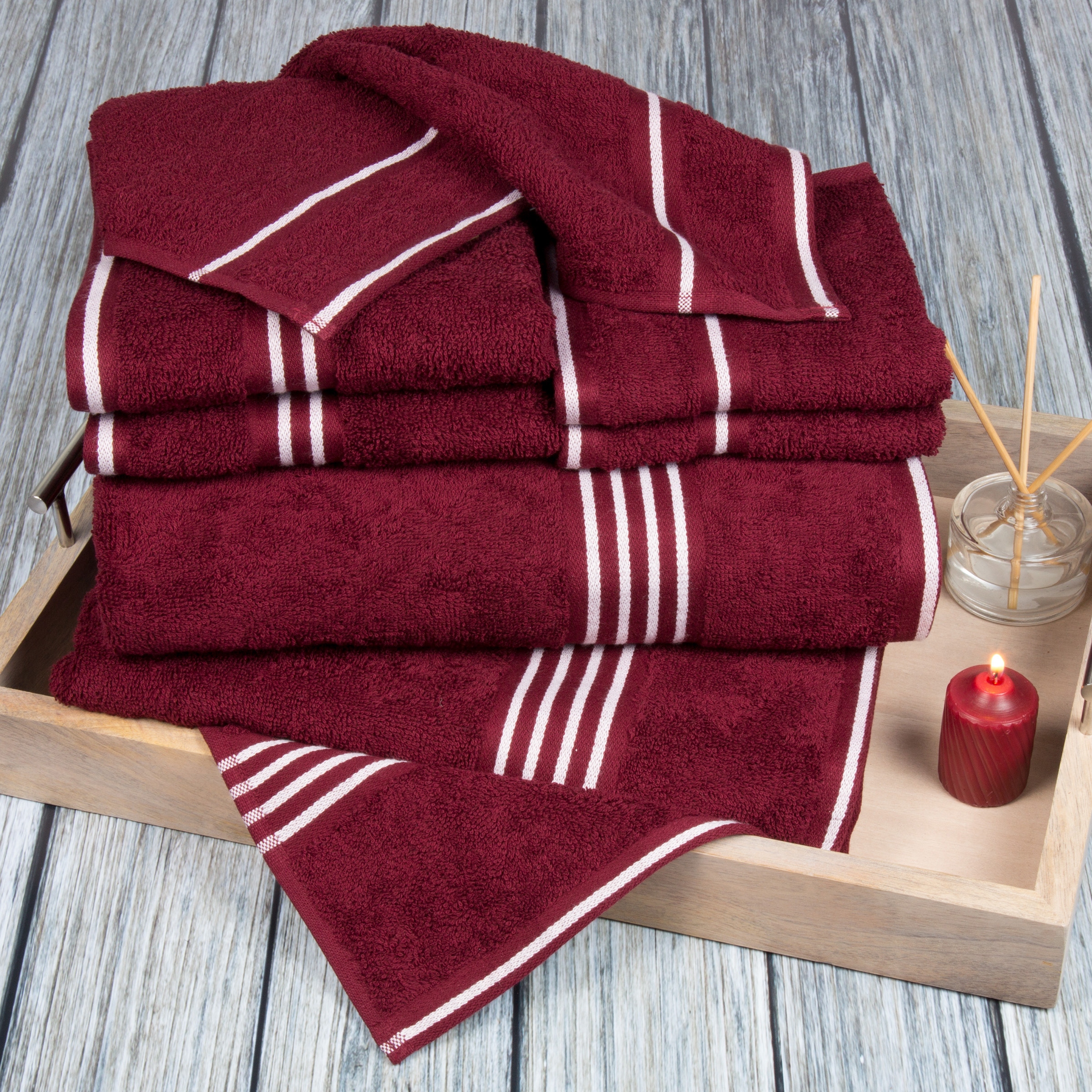 Burgundy towels top and bath mats